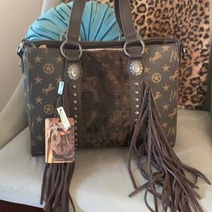 Montana west cowhide fringe purse NWT